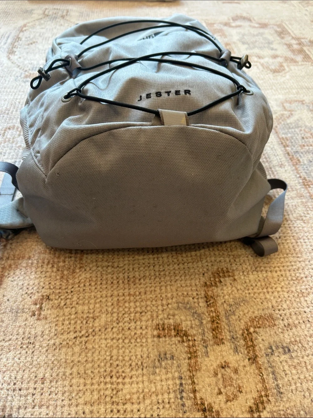 The North Face Jester Backpack in Light Gray with Black Bungee